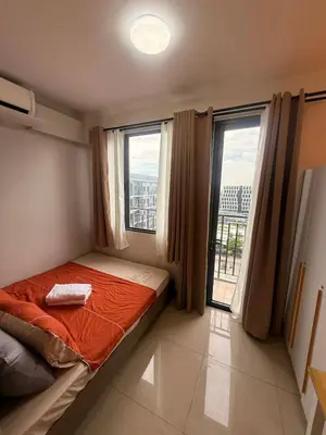 a bedroom with a bed and two large windows at Manila Flat Mall of Asia SMX city view with netflix in Manila