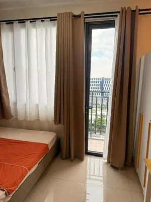 a bedroom with a bed and a large window at Manila Flat Mall of Asia SMX city view with netflix in Manila