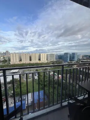 a view of a city from a balcony at Shore 2 Residences, Tower 1 in Manila