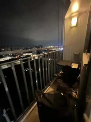 a room with a view of a city at night at Shore 2 Residences, Tower 1 in Manila