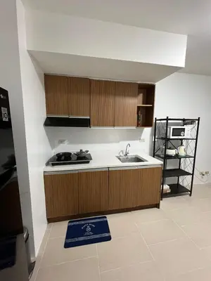 a kitchen with a sink and a counter top at Antel Spa Residences 1708 in Manila