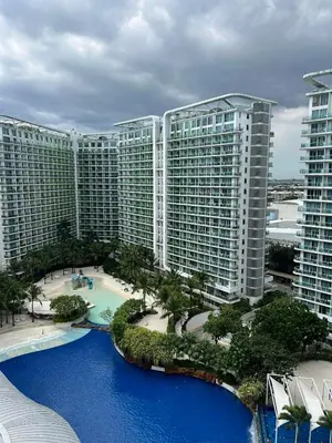 an aerial view of a large building with blue water at The Bawhaus in Manila