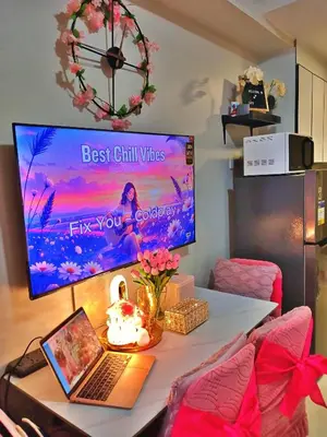 a room with a desk with a laptop on it at Blush & Glam at SMDC Fame Residences Tower 3 in Manila