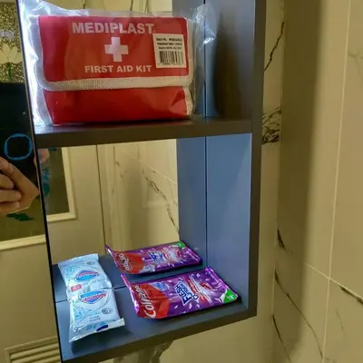 a shelf in a bathroom with some toothbrushes and a bag at Cozy Private Retreat with Kitchen & Balcony in Bacoor