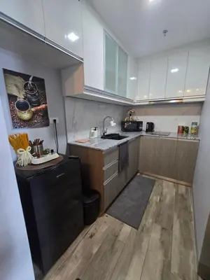 a kitchen with a sink and a counter top at Gentry Manor Okada Westside City Paranaque by Royale Prestige Le Maison in Manila