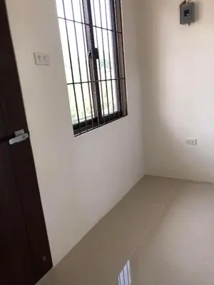 a empty room with a window and a floor at Wilabdaman manila in Manila