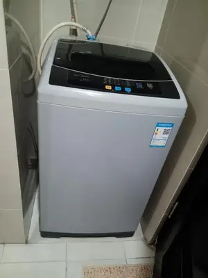 a washing machine sitting on top of a counter at Cluster 1 9N in Manila