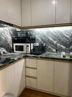a kitchen with a microwave and a sink at 81 Newport Building across NAIA Terminal 3 C5-8C in Manila