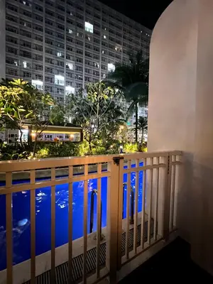 a view from the balcony of a hotel at night at Shore Residences Direct Pool Access in Manila
