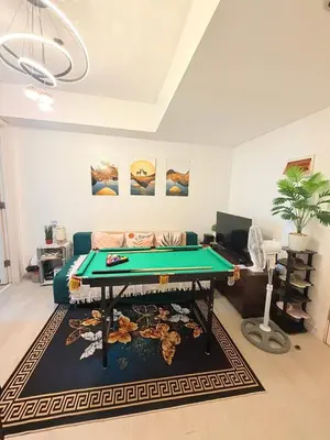 a living room with a pool table in it at Azure Destiny's Suites 1912 in Manila