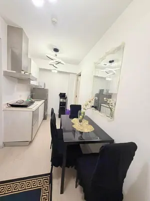 a kitchen and dining room with a table and chairs at Azure Destiny's Suites 1912 in Manila