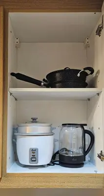 a shelf with a pot and a toaster and a blender at Low Floor 1BR Balcony Shell near MOA Shell001 in Manila