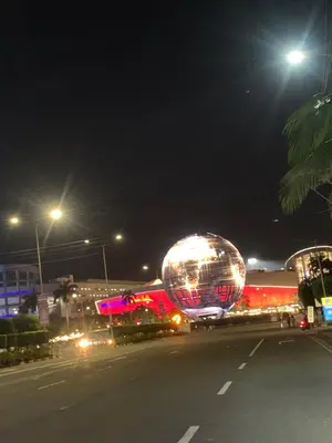 a large disco ball on the side of a street at night at MOA Condo Stay with balcony Pool View 2 Beds in Manila