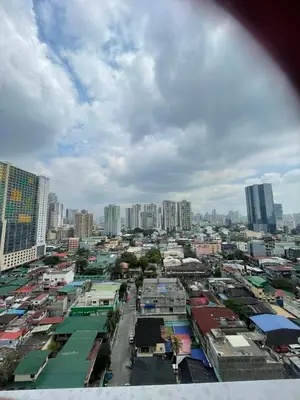 a view of a city with many buildings at Breeze Residences in Manila