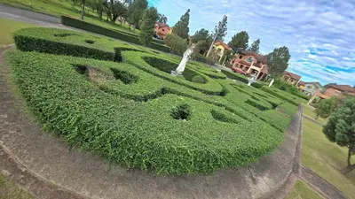 a grassy hill with a sign in the middle at 924 Villa Tropez Tower in Manila