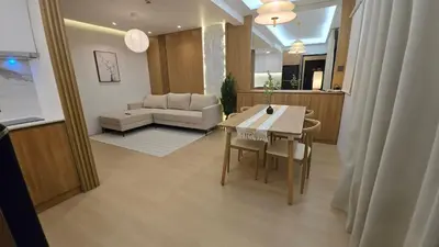 a living room with a table and a couch at 924 Villa Tropez Tower in Manila
