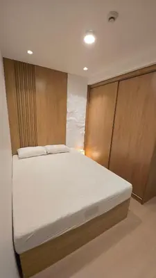 a bedroom with a white bed in a room at 924 Villa Tropez Tower in Manila