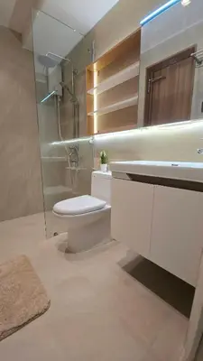 a bathroom with a toilet and a sink and a shower at 924 Villa Tropez Tower in Manila