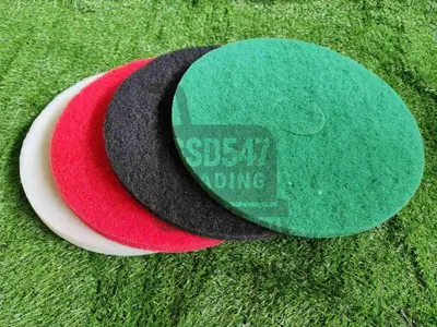 a red black and green hat on the grass at Jaustine's Cabin in Manila