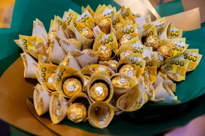 a pile of gold wrapped cookies on a plate at Jaustine's Cabin in Manila