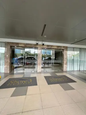 an empty lobby with two mats on the floor of a building at Gateway mall of asia shore 3 near Airport Malls in Manila