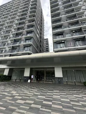 a large building with people standing in front of it at Gateway mall of asia shore 3 near Airport Malls in Manila
