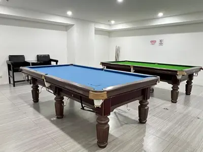 two pool tables sitting in a room with at Great View at Pioneer Mandaluyong Free Pool Gym Netflix Fast Wifi in Manila