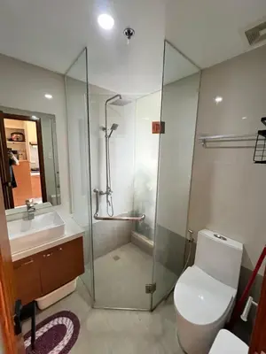 a bathroom with a shower and a toilet and a sink at Great View at Pioneer Mandaluyong Free Pool Gym Netflix Fast Wifi in Manila