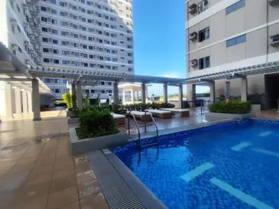 a swimming pool in the middle of a building at Naomi's Green Haven in Dasmariñas