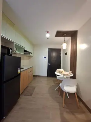 a kitchen and dining room with a table and chairs at THE Faithful Nest in General Trias