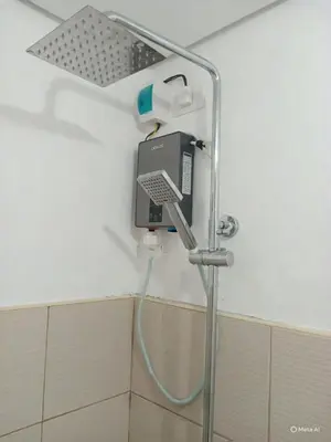 a shower in a hospital bathroom with a hose at SELF CHECK-IN Near La Salle Dasma in Dasmariñas