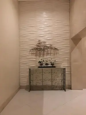 a shelf in a room with a wall at Sleep and Fly Condotel in Manila