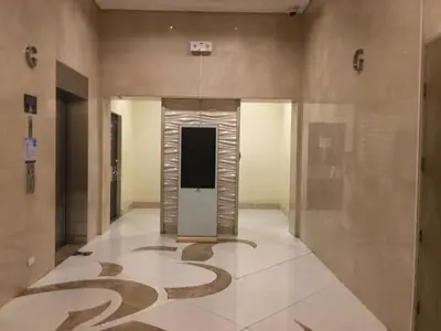 a hallway with a sign on the floor of a building at Sleep and Fly Condotel in Manila