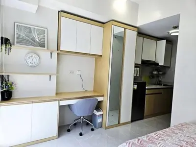 a small kitchen with a desk in a room at MANILA AIR RESIDENCE 24 floor in Manila