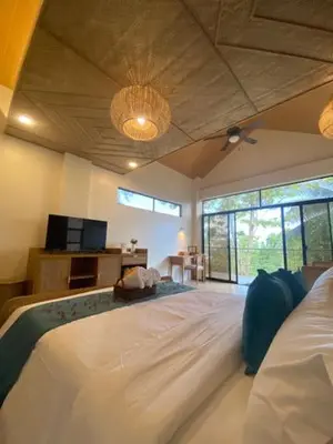 a bedroom with a large white bed in a room at Island Garden Beach Resort in Manila