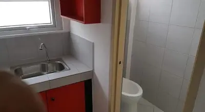 a small bathroom with a sink and a toilet at ChaerinCL in Manila