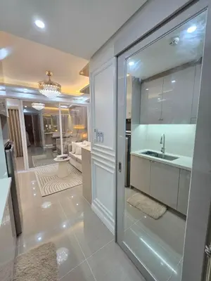 a kitchen with a sink and a counter at Royal Suites at Shore Residences near SM MOA and Airport in Manila