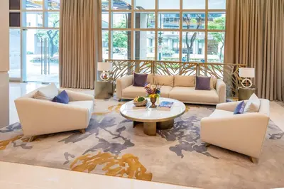 a living room with couches and a coffee table at Uptown BGC Condo in Manila