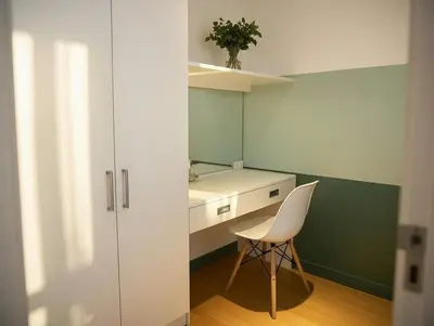 a small room with a white desk and a chair at Stylish Stay in BGC 5th Ave with Free Parking in Manila
