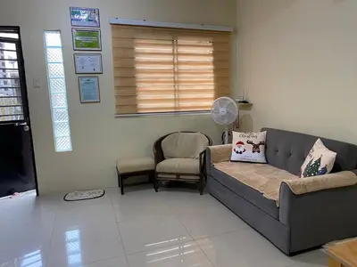a living room with a couch and a chair at 1BR Cozy Townhouse - AC in room only in General Trias