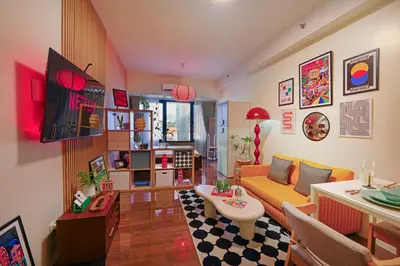 a living room with a couch and a table at Airhaus Studio in Manila