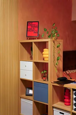 a book shelf with a plant on top of it at Airhaus Studio in Manila