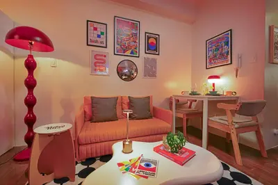 a living room with a couch and a table at Airhaus Studio in Manila
