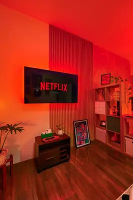 a living room with a netflix sign on the wall at Airhaus Studio in Manila