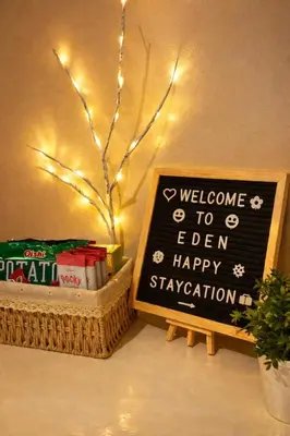 a sign with a welcome to ieen happy propagation at Modern 1BR One Uptown Residence Walk to UptownMall in Manila