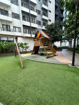 a playground in front of a large building at Casa Bella Retreat in Manila