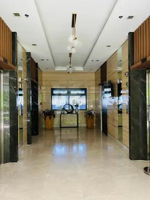 a lobby with a large room with glass doors at Casa Bella Retreat in Manila