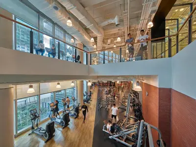 a gym with treadmills and people on tread machines at Shangri-La The Fort, Manila in Manila