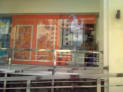 a store window with a view of a store at Palm Tree Genlex Condo in Manila