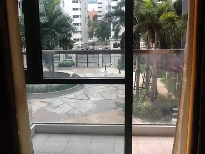 a view from a window of a city street at Palm Tree Genlex Condo in Manila